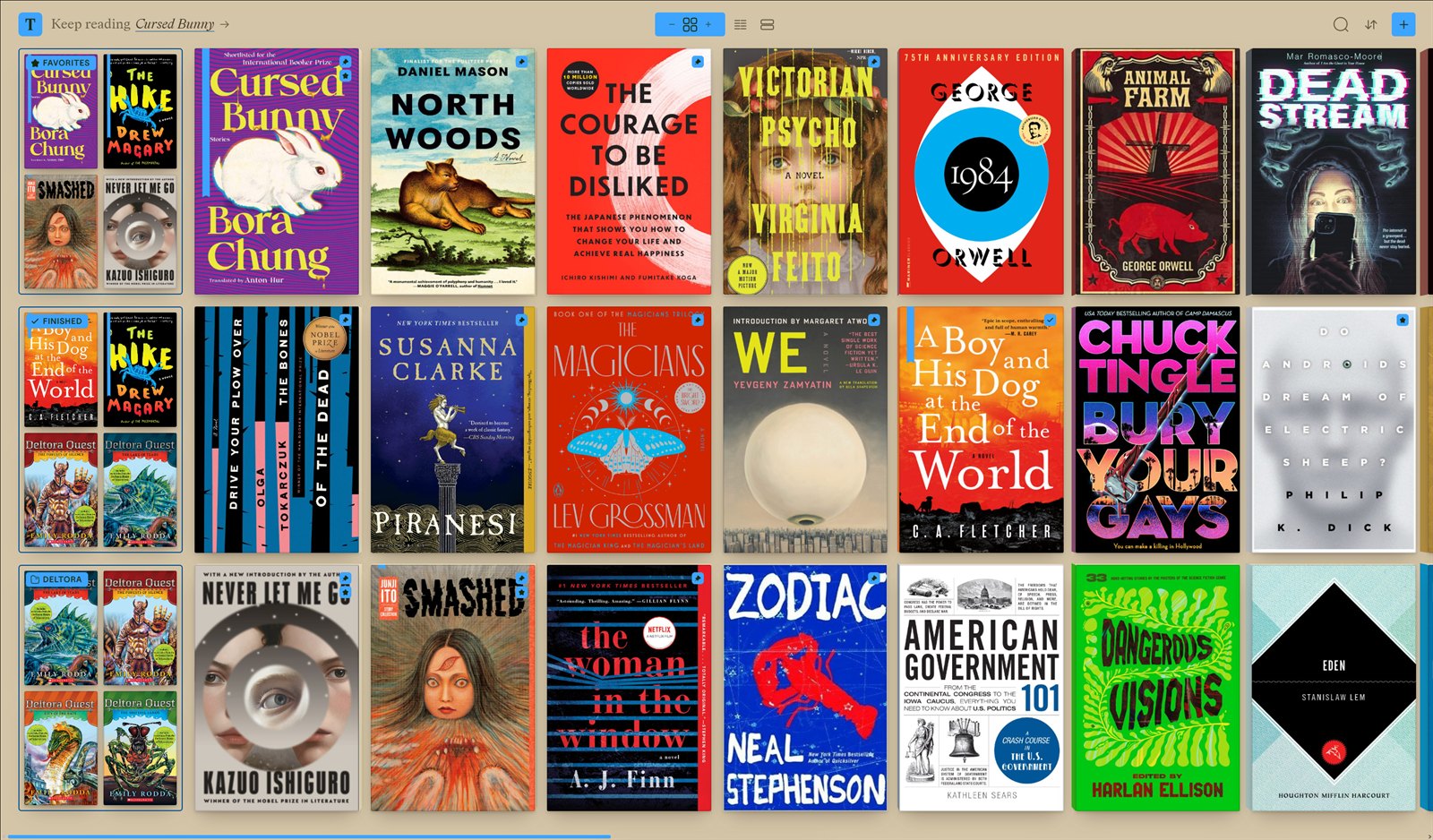 The Tomen library — a grid of book and comic covers, with view toggles and reading marks